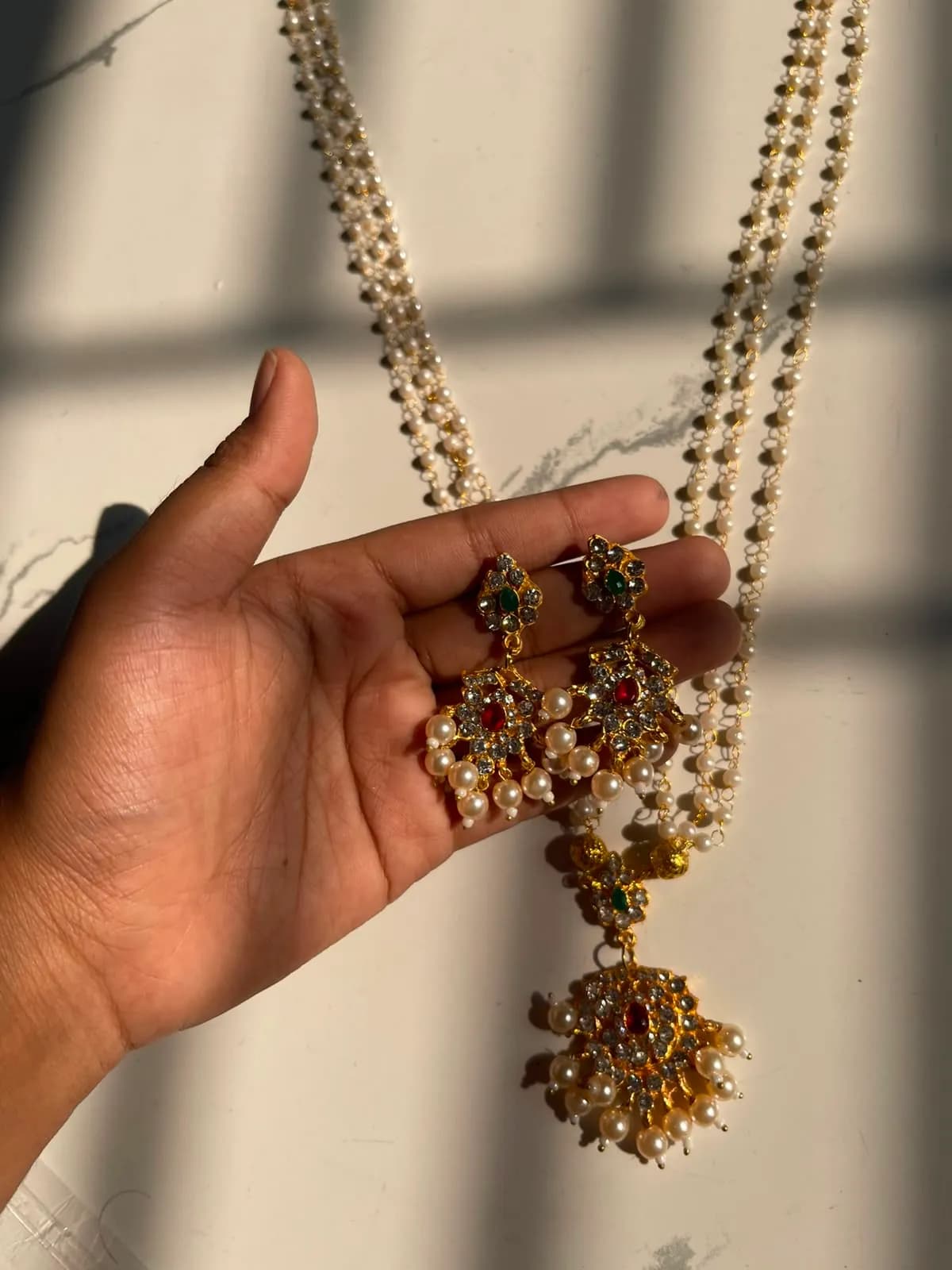 Regal Multi-Strand Pearl Rani Haar Set with Red & Green Stones